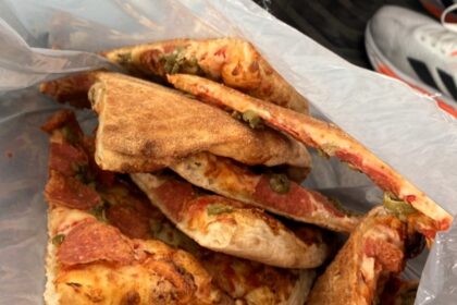 Woman shocked as Too Good To Go pizza arrives loose in plastic bag - viral TikTok sparks refund and apology after hygiene concerns over £3.70 order.