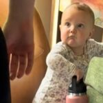 Baby Julia steals hearts in viral video as she hauls heavy water bottle to her mum mid-workout. The 11-month-old’s sweet gesture shows strength, love, and pure determination.