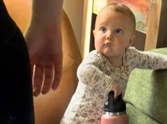 Baby Julia steals hearts in viral video as she hauls heavy water bottle to her mum mid-workout. The 11-month-old’s sweet gesture shows strength, love, and pure determination.