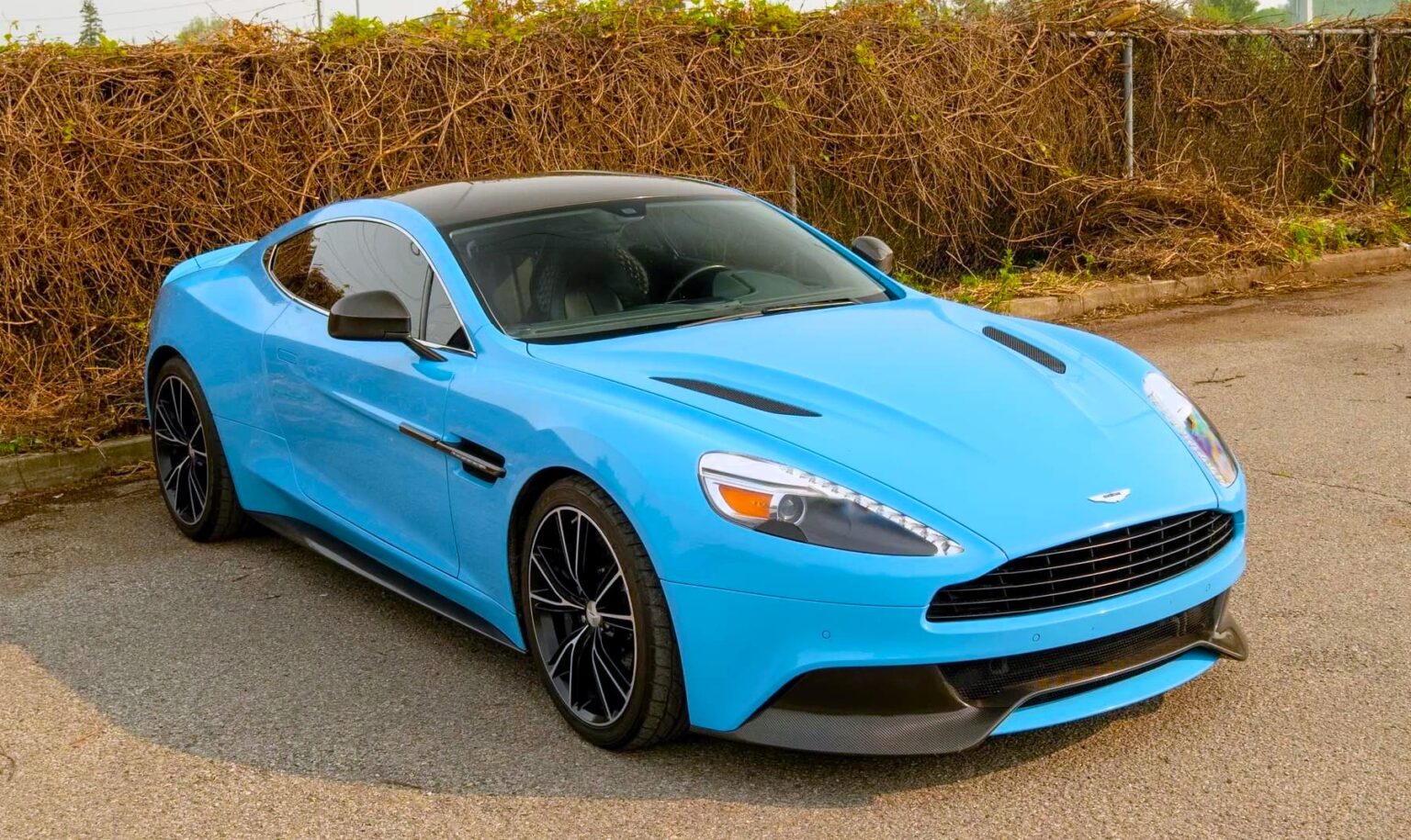 A V12 Aston Martin Vanquish featured on Top Gear and Jay Leno’s Garage, once driven by Bond and James May, is up for grabs in Toronto with bidding starting at £10,000.
