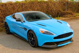 A V12 Aston Martin Vanquish featured on Top Gear and Jay Leno’s Garage, once driven by Bond and James May, is up for grabs in Toronto with bidding starting at £10,000.