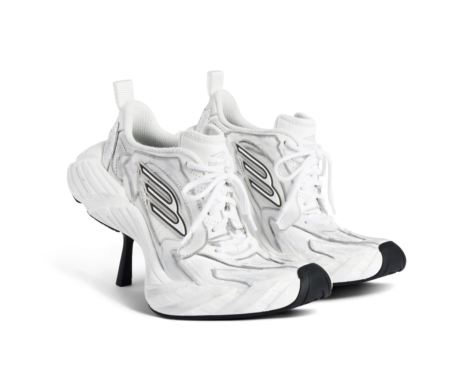 Balenciaga's £820 high-heeled trainers spark backlash for blending stilettos with sneakers in its Fall 2025 line - mocked online for style over practicality.
