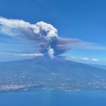 A British couple saw Mount Etna erupt from their plane just hours after racing up the volcano during a championship in Sicily, capturing a dramatic and rare sight.