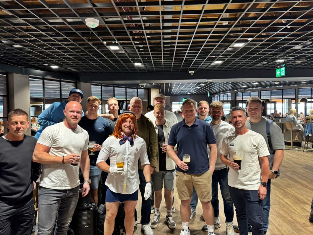 Groom-to-be pranked as cabin crew on flight to stag do - dons uniform, helps with safety demo and rubbish collection as passengers and Ryanair staff enjoy the laughs.