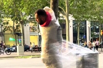 Stag do prank in Barcelona sees groom-to-be cling filmed to a tree until he raises €50, earning beer for every coin as viral video racks up nearly 2 million views.