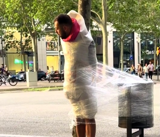 Stag do prank in Barcelona sees groom-to-be cling filmed to a tree until he raises €50, earning beer for every coin as viral video racks up nearly 2 million views.