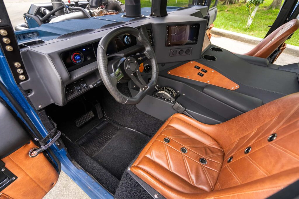 A custom 1987 AM General Humvee with 750hp, air suspension, and just 1,700 miles is turning heads at auction, blending rat rod style with extreme off-road performance.