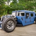 A custom 1987 AM General Humvee with 750hp, air suspension, and just 1,700 miles is turning heads at auction, blending rat rod style with extreme off-road performance.