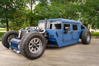 A custom 1987 AM General Humvee with 750hp, air suspension, and just 1,700 miles is turning heads at auction, blending rat rod style with extreme off-road performance.