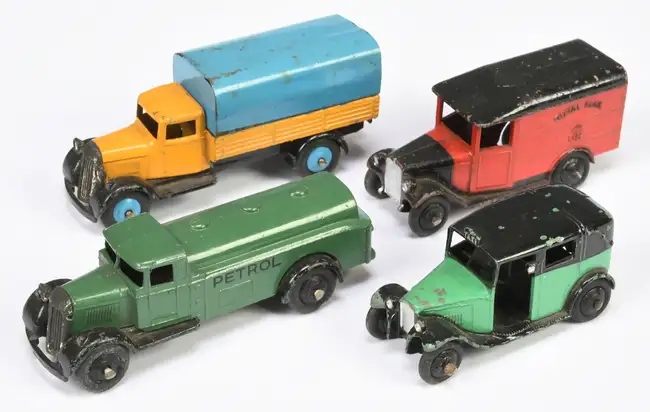Over 600 rare Dinky Toys sold for £87,520 at auction, including a record-breaking Thunderbird 2 and Weetabix van, highlighting global demand for vintage collectibles.