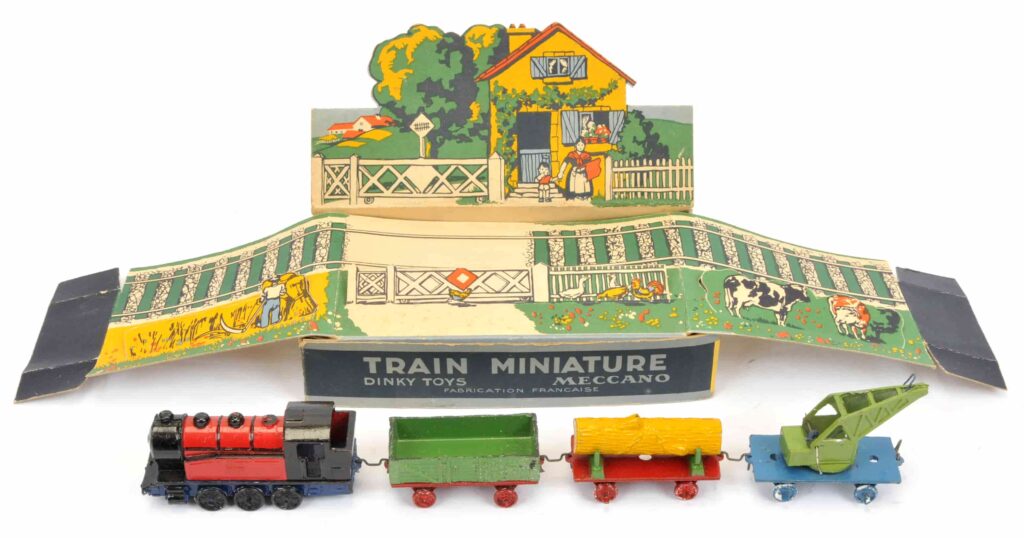 Over 600 rare Dinky Toys sold for £87,520 at auction, including a record-breaking Thunderbird 2 and Weetabix van, highlighting global demand for vintage collectibles.