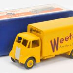 Over 600 rare Dinky Toys sold for £87,520 at auction, including a record-breaking Thunderbird 2 and Weetabix van, highlighting global demand for vintage collectibles.