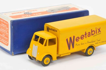 Over 600 rare Dinky Toys sold for £87,520 at auction, including a record-breaking Thunderbird 2 and Weetabix van, highlighting global demand for vintage collectibles.