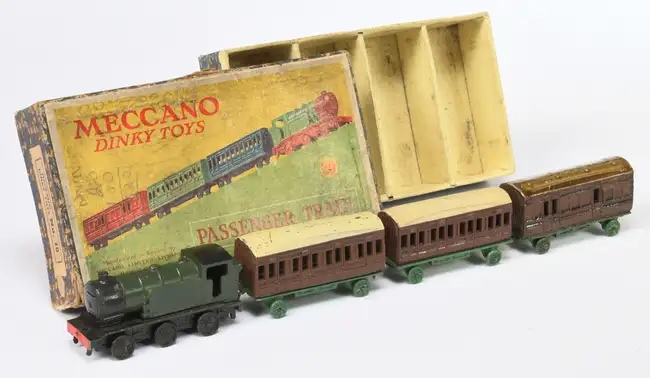 Over 600 rare Dinky Toys sold for £87,520 at auction, including a record-breaking Thunderbird 2 and Weetabix van, highlighting global demand for vintage collectibles.