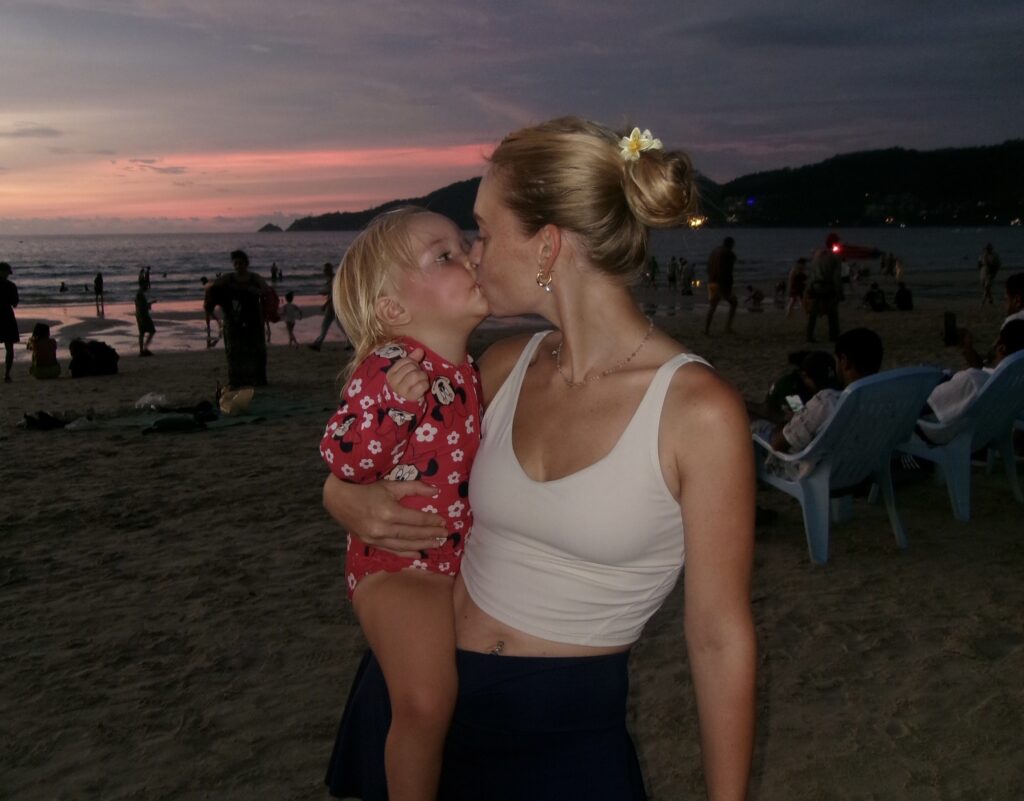 Backpacking mum Kaylie Bryson defends letting toddler kayak without life jacket in viral video from the Philippines - says calm waters and safety training made it a safe choice.