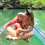 Backpacking mum Kaylie Bryson defends letting toddler kayak without life jacket in viral video from the Philippines - says calm waters and safety training made it a safe choice.