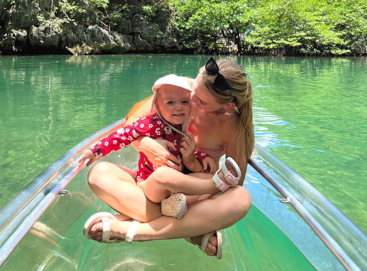 Backpacking mum Kaylie Bryson defends letting toddler kayak without life jacket in viral video from the Philippines - says calm waters and safety training made it a safe choice.