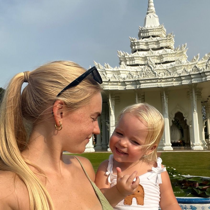 Backpacking mum Kaylie Bryson defends letting toddler kayak without life jacket in viral video from the Philippines - says calm waters and safety training made it a safe choice.