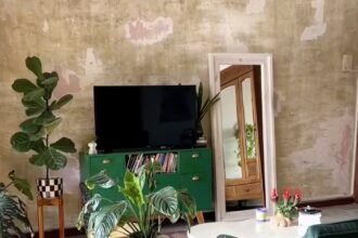 Micro influencer slammed for using ChatGPT to design £3.65 textured wall - sparks backlash for mimicking low-income aesthetic but defends DIY as personal expression.