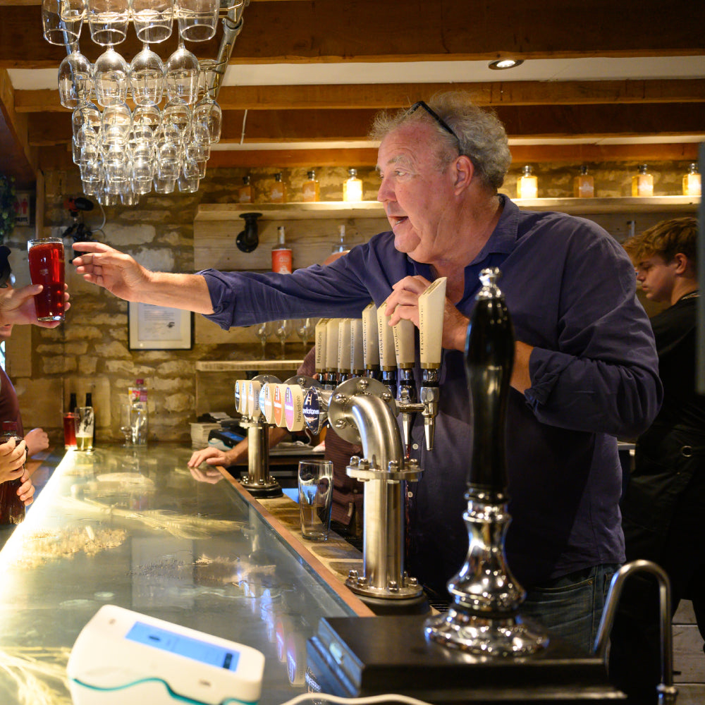 Jeremy Clarkson’s £40k pub umbrellas at The Farmer’s Dog backfired as rain pooled and poured onto decking, leaving staff scrambling and visitors amused by the mishap.