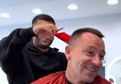 John Terry jumped out of his seat after his barber pranked him with a giant red comb mid haircut, leaving everyone in the shop, including fans online, in stitches.