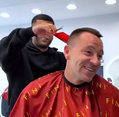 John Terry jumped out of his seat after his barber pranked him with a giant red comb mid haircut, leaving everyone in the shop, including fans online, in stitches.