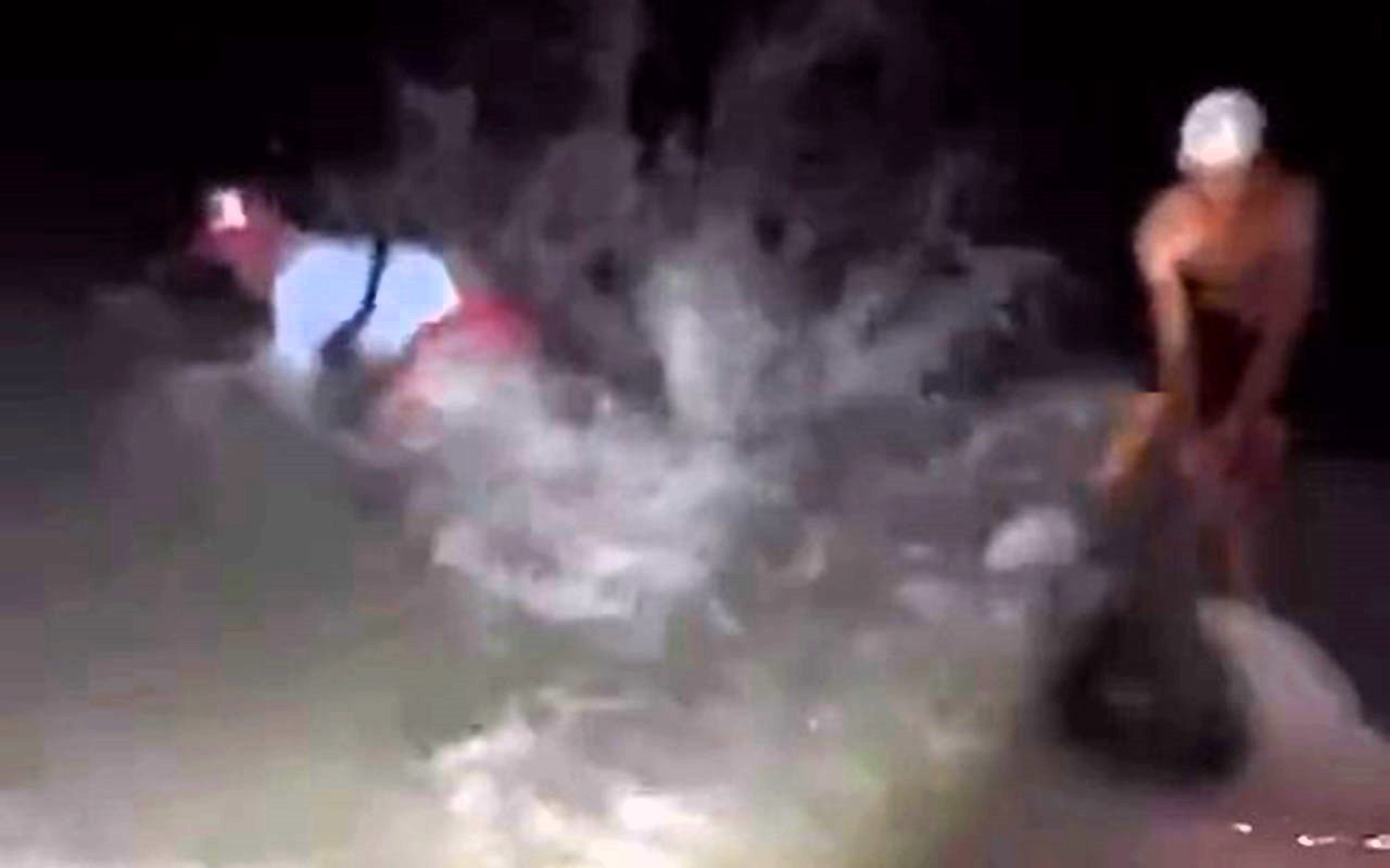 A man was hilariously "baptised" by a hammerhead shark after freeing it from a hook, getting knocked into the sea by its thrashing tail near Marco Island, Florida.