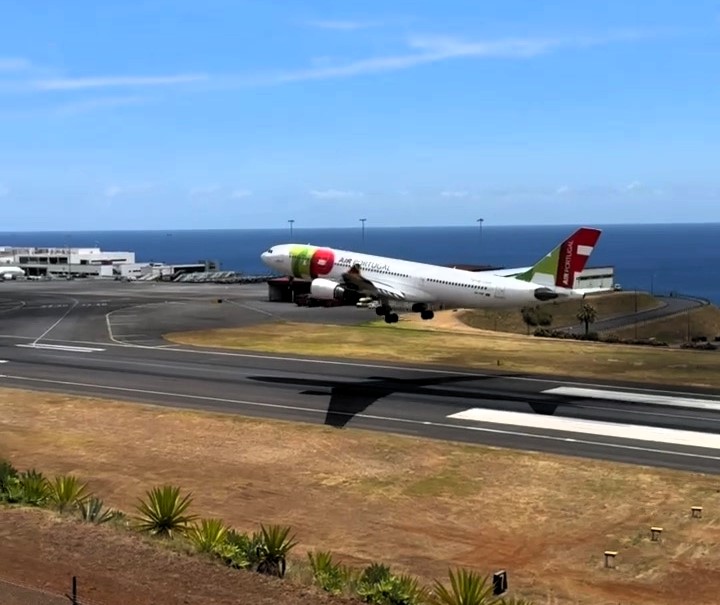 TAP Air Portugal jet lands on third attempt in windy Madeira as plane spotter captures dramatic footage - pilot praised after tense touchdown at tricky airport.