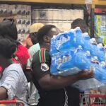 Costco shoppers in east London panic buy bottled water amid UK 30C heatwave - scenes likened to Covid rush as customers clear shelves during summer stock-up.