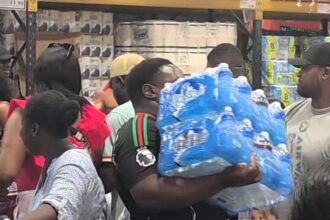 Costco shoppers in east London panic buy bottled water amid UK 30C heatwave - scenes likened to Covid rush as customers clear shelves during summer stock-up.