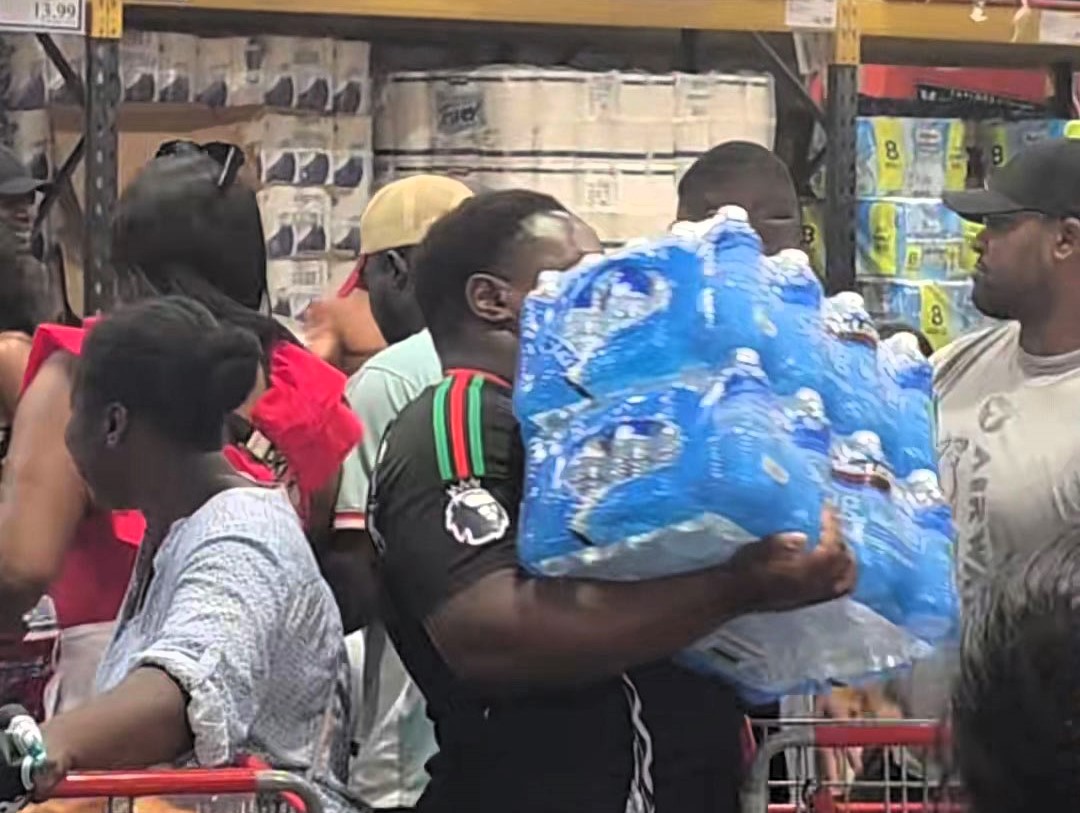 Costco shoppers in east London panic buy bottled water amid UK 30C heatwave - scenes likened to Covid rush as customers clear shelves during summer stock-up.