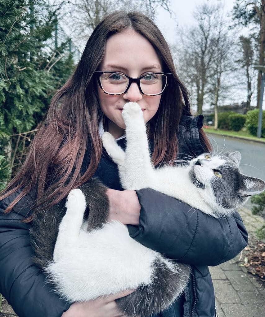 Dusty the cat vanished from the Isle of Man and was found 400 miles away in Devon after stowing away in a van. A fundraiser has helped reunite her with her grateful owner.