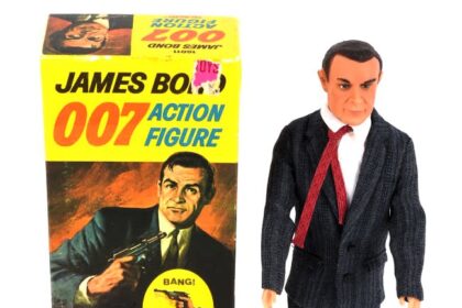 A rare 1965 Sean Connery James Bond doll sold for £6,500 at auction, alongside iconic 007 collectibles including watches, guns and spy gear in Surrey.
