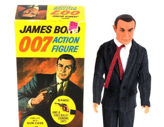 A rare 1965 Sean Connery James Bond doll sold for £6,500 at auction, alongside iconic 007 collectibles including watches, guns and spy gear in Surrey.