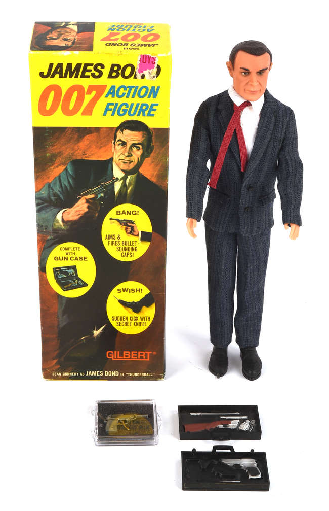 A rare 1965 Sean Connery James Bond doll sold for £6,500 at auction, alongside iconic 007 collectibles including watches, guns and spy gear in Surrey.