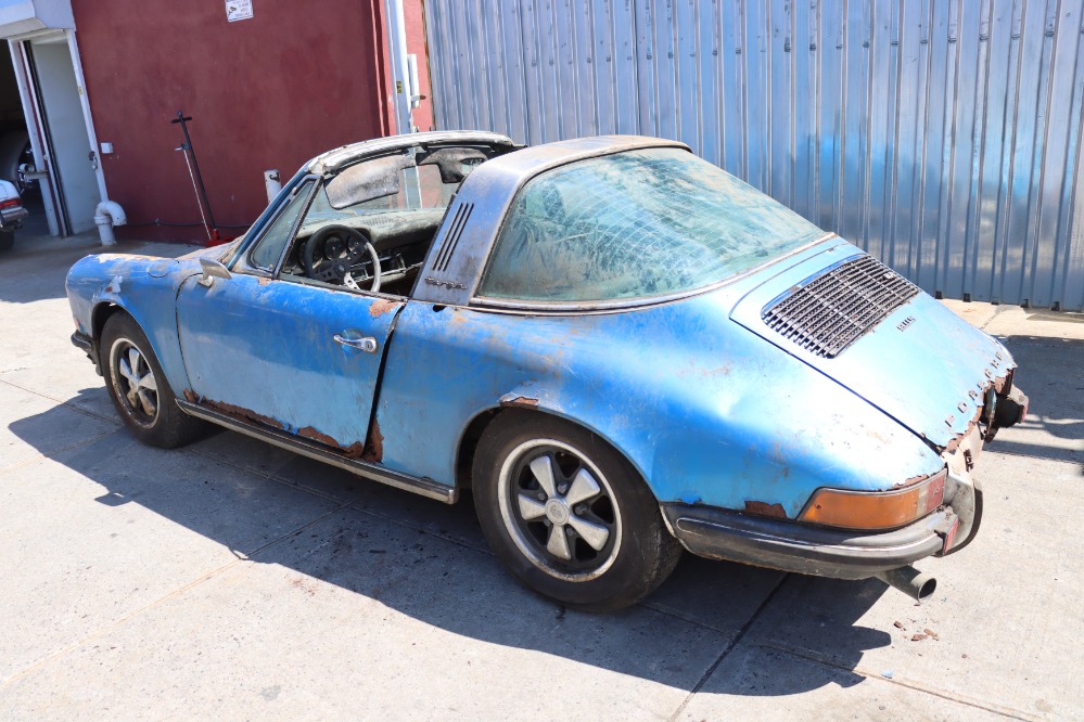 A rust-covered 1972 Porsche 911S Targa in rare Gemini blue has surfaced after decades in a barn and is now for sale in New York for nearly £50,000 as a restoration project.