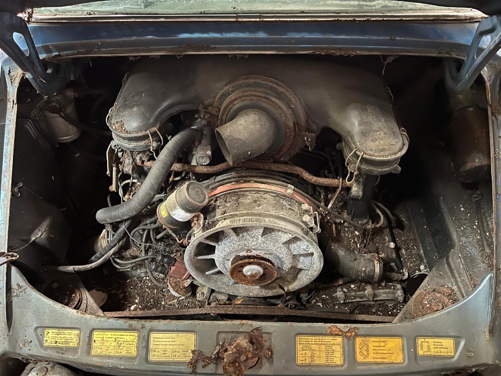 A rust-covered 1972 Porsche 911S Targa in rare Gemini blue has surfaced after decades in a barn and is now for sale in New York for nearly £50,000 as a restoration project.
