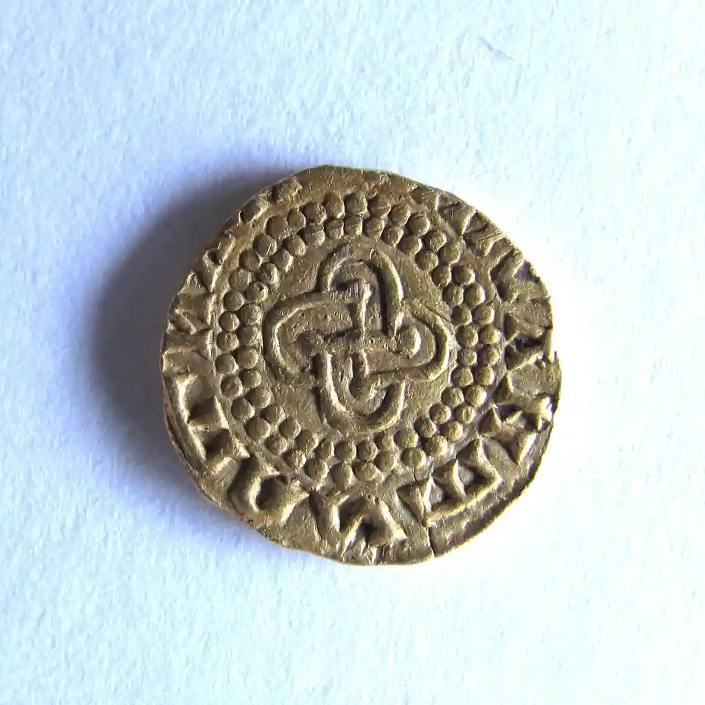 A rare Anglo-Saxon gold coin dating back to AD640-660 has been unearthed in Norfolk, blending Christian and pagan symbols in what experts call a major archaeological find.
