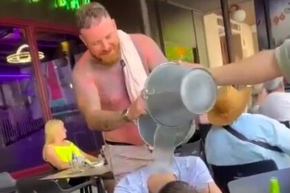 Stag do prank stuns snoozing Brit George Hall as mates dump ice buckets on him mid-nap, sparking laughs, a fall, and mixed reactions online over safety concerns.