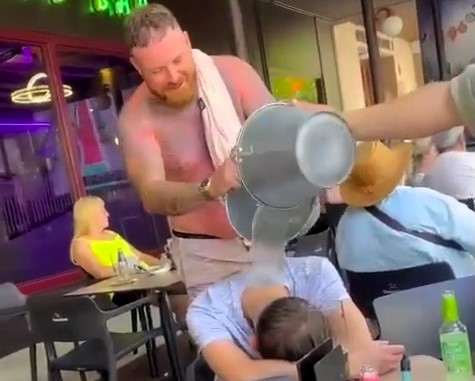 Stag do prank stuns snoozing Brit George Hall as mates dump ice buckets on him mid-nap, sparking laughs, a fall, and mixed reactions online over safety concerns.