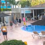 Sunbed chaos erupts at Benidorm’s Sol Pelícanos Ocas hotel, famous for ITV’s Benidorm show, as Brits queue from 7:30am and race for loungers at pool opening.