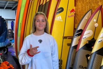 Robyn Larg, 18, becomes youngest British woman to surf Nazaré's 25ft waves in Portugal - joins brother Ben in conquering legendary Atlantic swells.