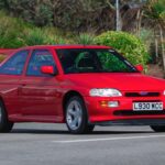 A 1993 Ford Escort RS Cosworth sold for £105,750 in time-warp condition with just 12,530 miles, rare specs and complete original documentation from its sole owner.
