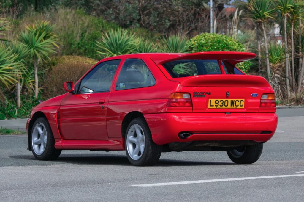 A 1993 Ford Escort RS Cosworth sold for £105,750 in time-warp condition with just 12,530 miles, rare specs and complete original documentation from its sole owner.
