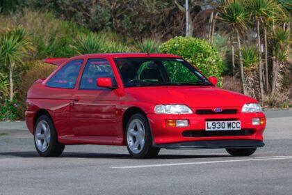 A 1993 Ford Escort RS Cosworth sold for £105,750 in time-warp condition with just 12,530 miles, rare specs and complete original documentation from its sole owner.