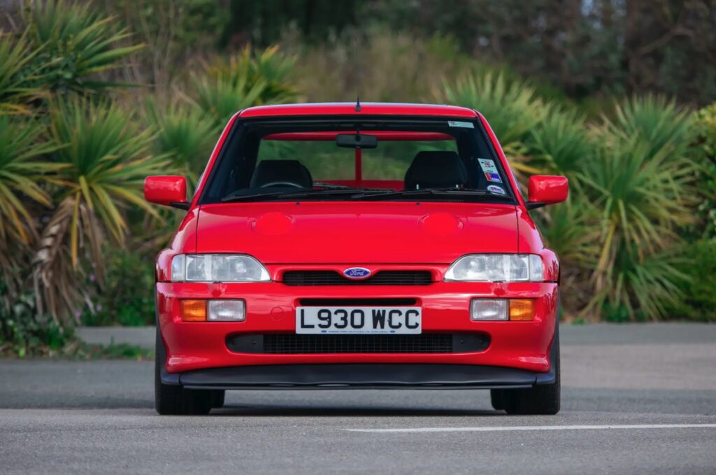A 1993 Ford Escort RS Cosworth sold for £105,750 in time-warp condition with just 12,530 miles, rare specs and complete original documentation from its sole owner.