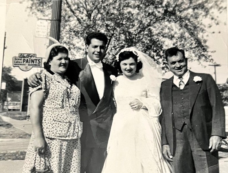 A 1953 wedding photo found in a donated book has been returned to the couple’s granddaughter, Sarah Ruggirello, after a library’s viral post helped track down the family.