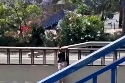 A woman was filmed dangerously crossing Spain's A7 motorway instead of using a nearby footbridge - locals say she does it often and fear a serious accident is imminent.