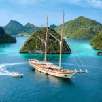 Sail Indonesia aboard Lamima - the world’s largest wooden sailing yacht offering luxury, diving, wellness and bespoke expeditions from £159,000 per week plus tax.