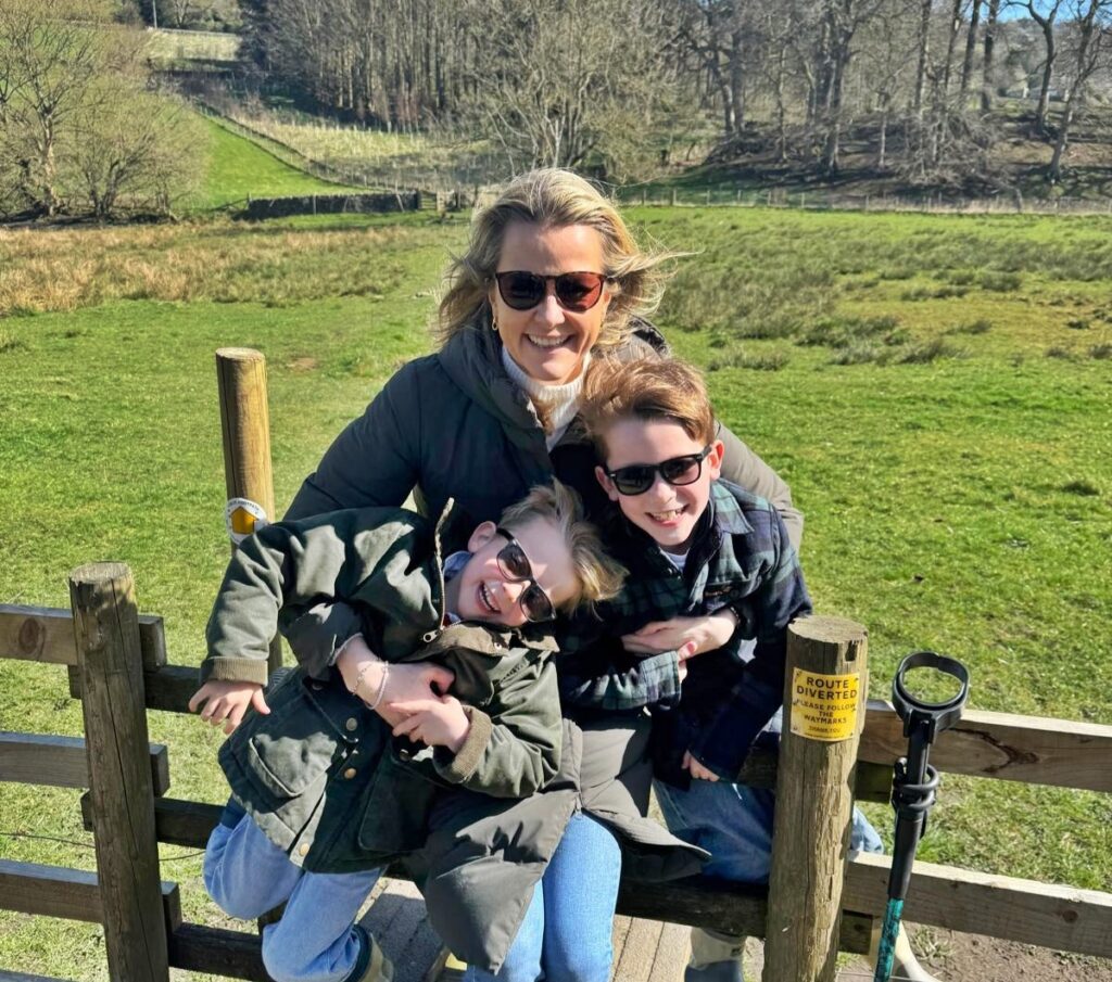 Amelia Peckham, a disabled mum once called selfish for having kids, proudly books summer off to be with her sons - proving her critics wrong with love and presence.